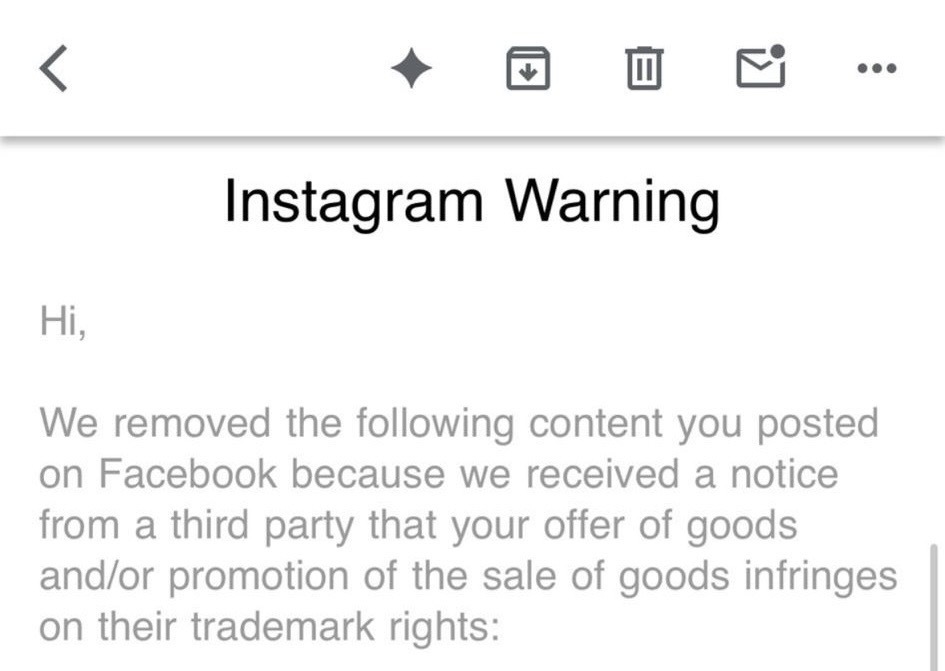 Screenshot of an Instagram warning about content removal due to trademark rights infringement related to Facebook post promotions.